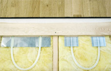 Roth Radiant Panel installation with PEX tubing under suspended wood sub floor