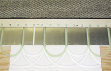 Roth Radiant Panel installation with PEX tubing above suspended wood sub floor